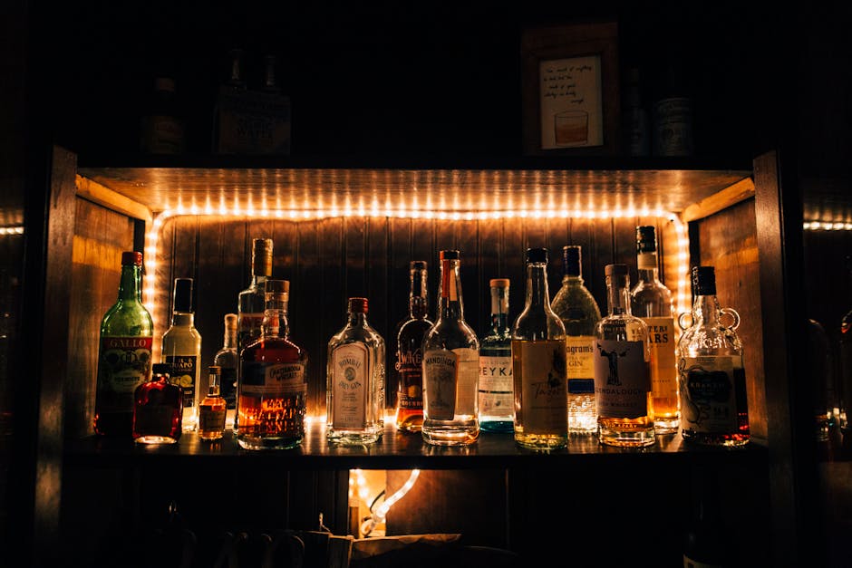 Ingredients for making bourbon cocktails arranged on a bar
